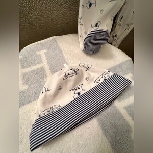 Worn once, cotton footed Pajamas with matching hat. Zero stains or wear and tear